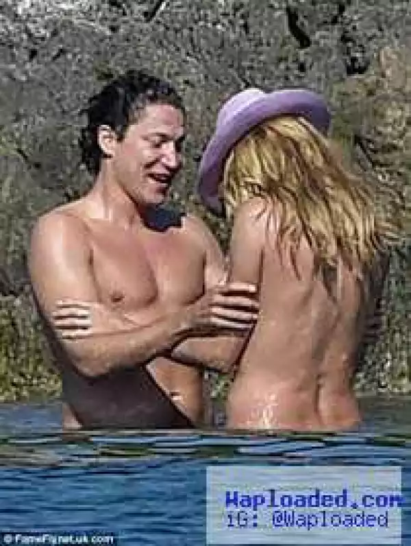 Heidi Klum topless on the beach with her boyfriend